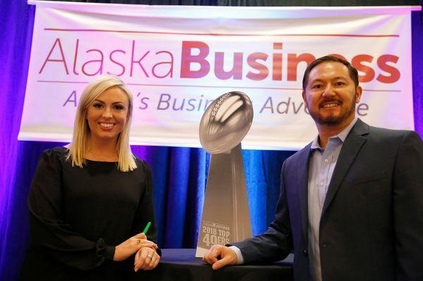 Kari Bustamante, KTUU Morning Edition Anchor, presenting with Charles Bell, Vice President Alaska Business at the 2018 Top 49ers Luncheon