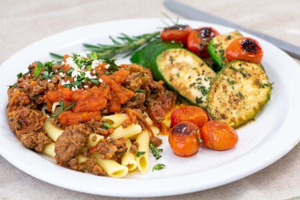 Bolognese over Penne Pasta, seared Zucchini, fire roasted Tomatoes