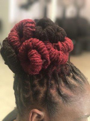 Locs colored and styled to perfection.