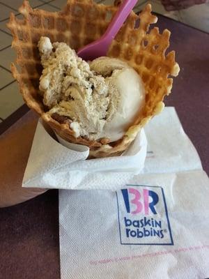 Single scoop butter pecan in waffle cone