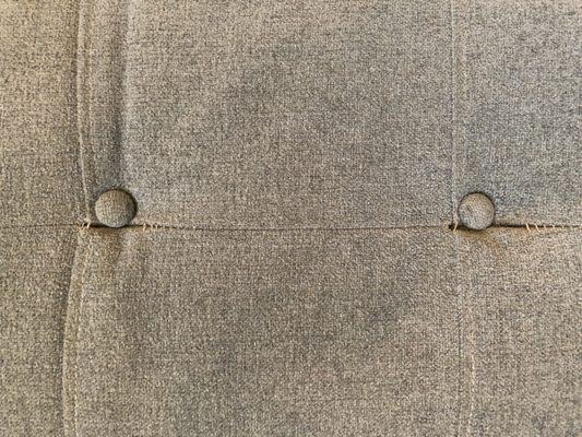 Tufted buttons pulling away from Younger Furniture sofa