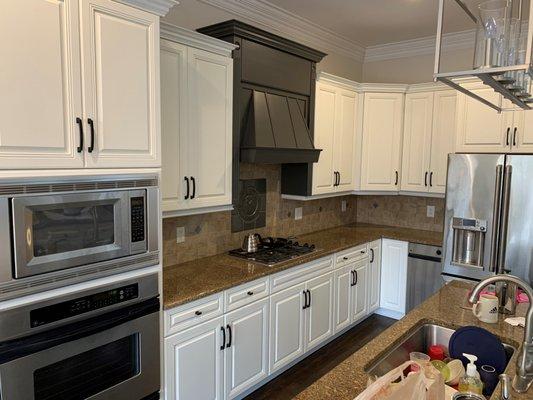 After photo of kitchen cabinet refinishing and color change.