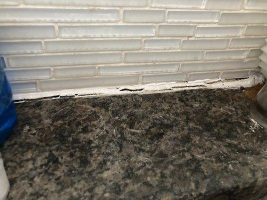 Split grout in kitchen allowing ants to come through.