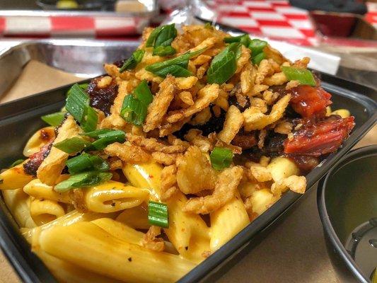 Homemade Mac n cheese topped with burnt ends crispy onions and chives. (Weekly special until 5/15)