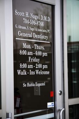 The front door of our Charlotte Northlake Dentist office.  Displays our hours of service...