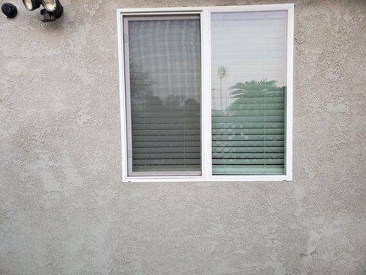 Added exterior stucco and matched texture to newly installed window.