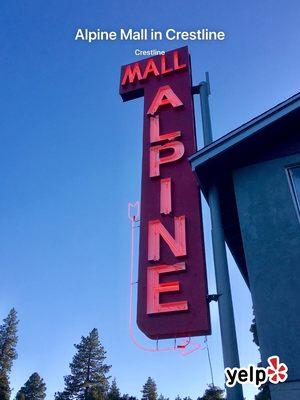 Historic Alpine Mall sign lit up for the first time in over 30 years