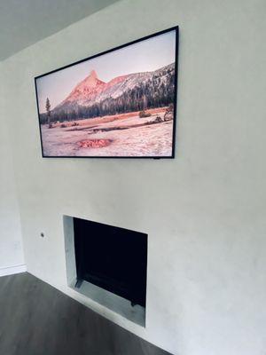 TV mounted on concrete wall