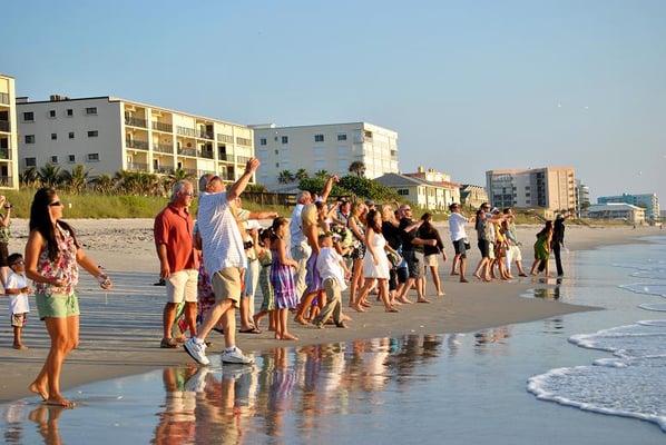 Wish on a shell ceremony with family and friends.