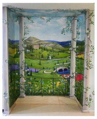 Tuscan themed mural painted inside a dining room niche.