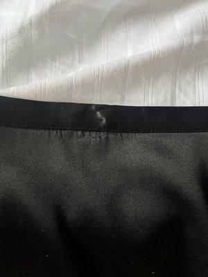 Black silk skirt with safety pin hole damage