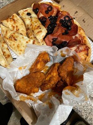 Pepperoni and olive pizza, breadsticks, and Wings