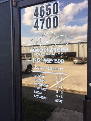 Eurocharged Performance's front door with business hours.