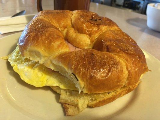 Croissant sandwich with egg and ham