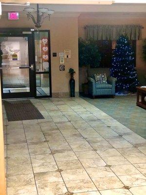 Entryway to ManorCare is decorated for the holidays! Love the ambiance! Warm + courteous.