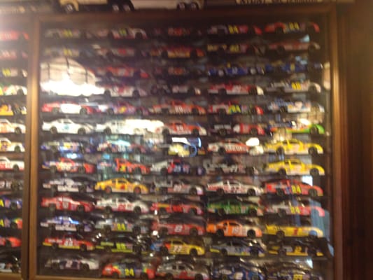 Just one of a number of wall displays of small racing cars.