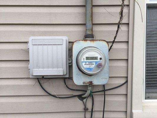 Electrical service meter was rusted and it was advised the moisture source be remedied and rust be addressed.