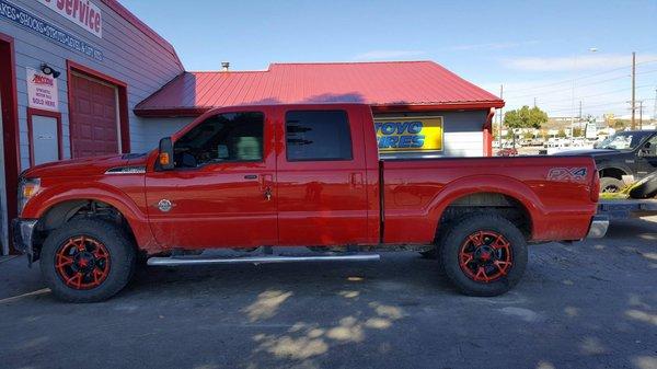 2016 Ford F250 with Rockstar III wheels and red inserts.