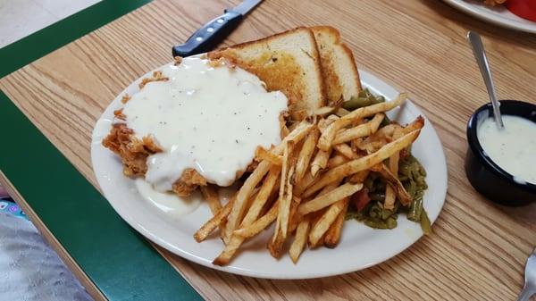 My wife ordered their chicken fried steak that's a hell of a plate I can't wait to eat some of it cuz I know she won't even know