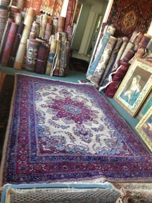 Large selection of Persian rugs.