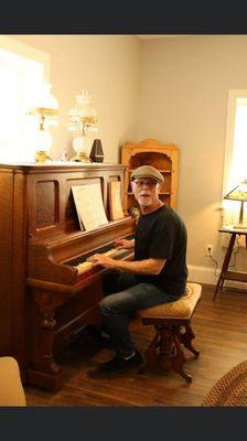 John Walmsley aka Jason at the piano at John & Olivia's Grand Opening