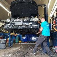 Auto mechanic expert fixing car