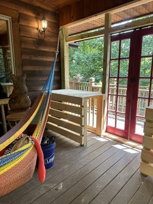 We built an outdoor cat aviary with cabinets to hide litter boxes