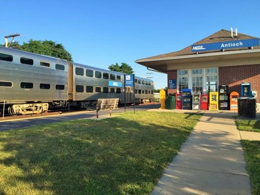 West View of Station showing newspaper vending and pay phone.