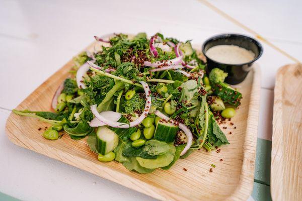 GREEN GODDESS SALAD
Tuscan Baby Kale, Broccoli, Cucumber, Edamame, Crispy Quinoa, Red Onion, Soft Herbs, Green Goddess Dressing