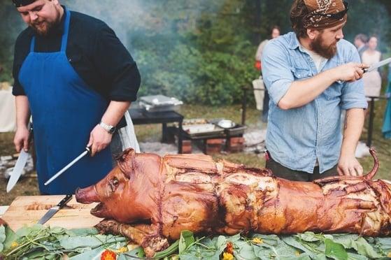 James Burden and Jazu Stine catering a pig roast