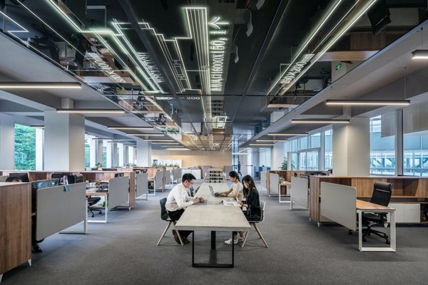 Corporate office environment with benching and modern cubicles