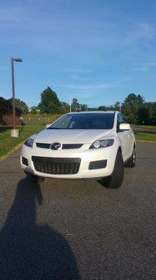 Mazda  Cx-7  crispy  pearl  white  going for  rent  Midsize  SUV   -  Gemini  Car  Rentals  LLC