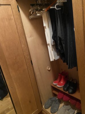 Closet with clothing and shoes not put out on the floor. Carpets and furniture we're not put out as well.