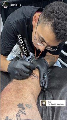 @inkjulio doing a tattoo