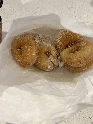 1/2 dozen powdered dinky donuts