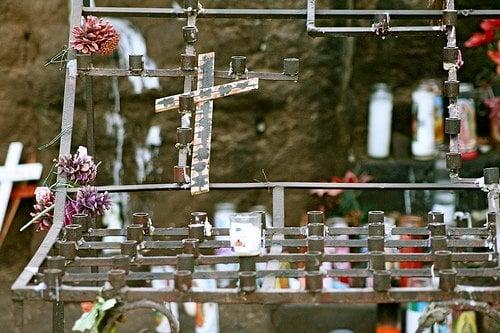 An altar of candles at the shrine.