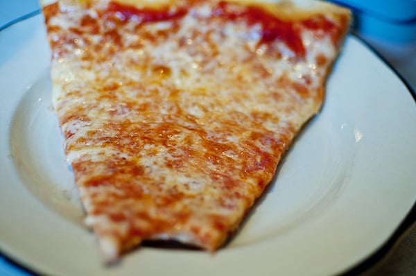 Plain cheese pizza. Crispy, chewy and thin in the crust... Saucy and cheesy on top. Perfect!