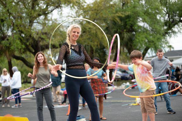 Katie hula hooping with the pubic at a local event