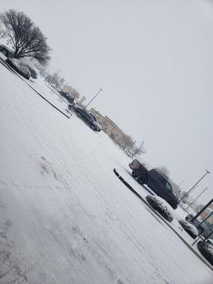 Snow packed Albertsons parking lot on New Years Day