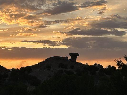 A beautiful picture of a sunset with Camel Rock.