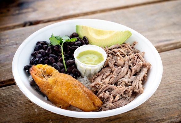 Lechon bowl Seared pork , rice Cuban style black beans, baked sweet plantain ,avocado.