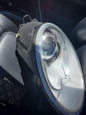 Broken headlight that came off car after Saeed installed