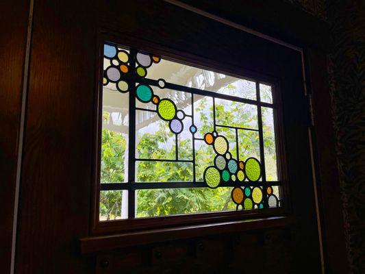 Leaded glass panels with Queen Anne grid and effervescent bubble theme