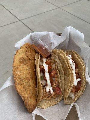 2 chicken tacos and a beef empanada