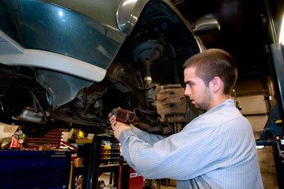 Dan D'Addario, working on a vehicle