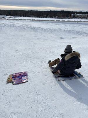 sledding with cardboard. You can bring your own sled gear.