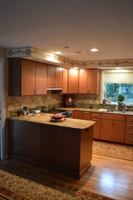 Sleek Aristokraft cabinetry and exotic granite countertops add so much style. Designed and installed by Attleboro Kitchen and Bath.