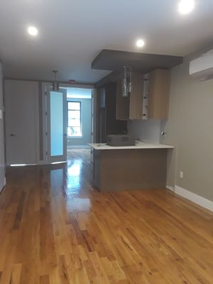 Moldings installation, skim coat , paint , door installed , floors polished & kitchen cabinet installed in Astoria Queens.