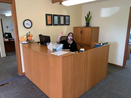 Vicki at the front desk ready to welcome clients