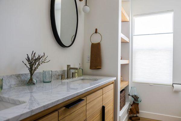 Honeycomb, cellular, shade in guest bathroom.